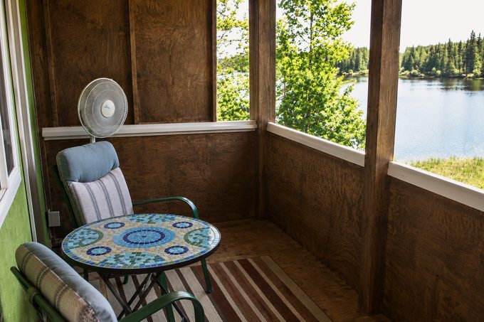 A screened porch looking over the lake at Eagle's Nest Resort.